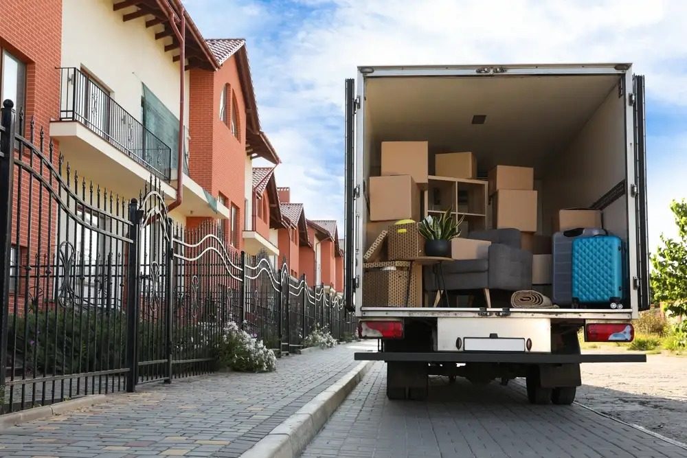 Team of movers transporting commercial equipment for a seamless business relocation.